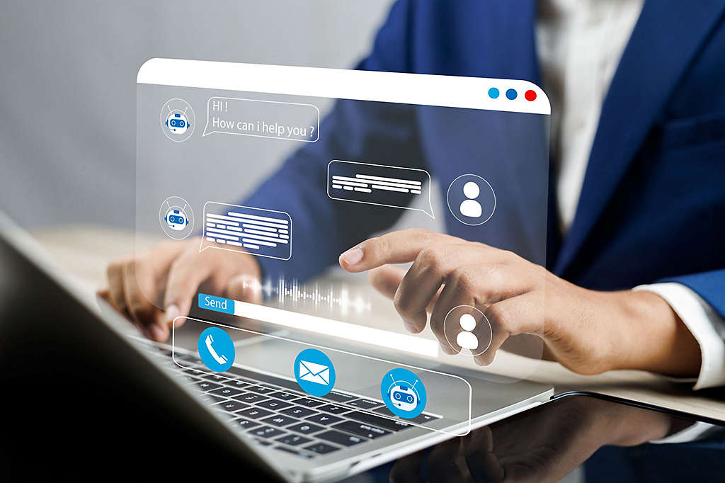 A person using a virtual chat on a laptop
