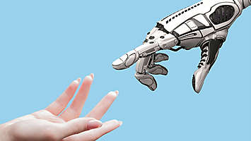 Robot hand and human hand reaching towards each other