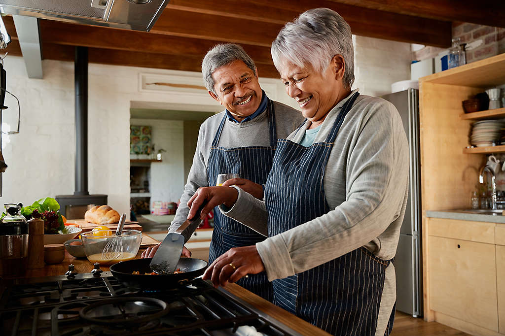 A couple cooking in the kitchen