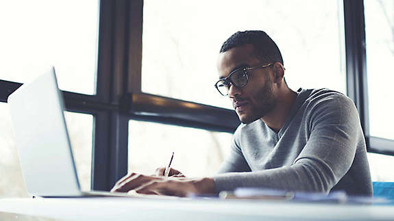 Young man working on his laptop.