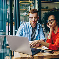 Man and Woman working on computer together