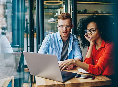 Man and Woman working on computer together