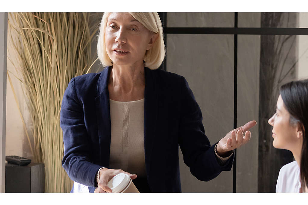 Woman presenting to a group of financial professionals