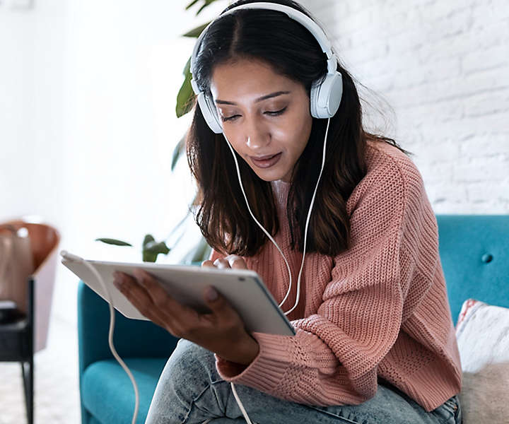 Woman listening to music on Ipad