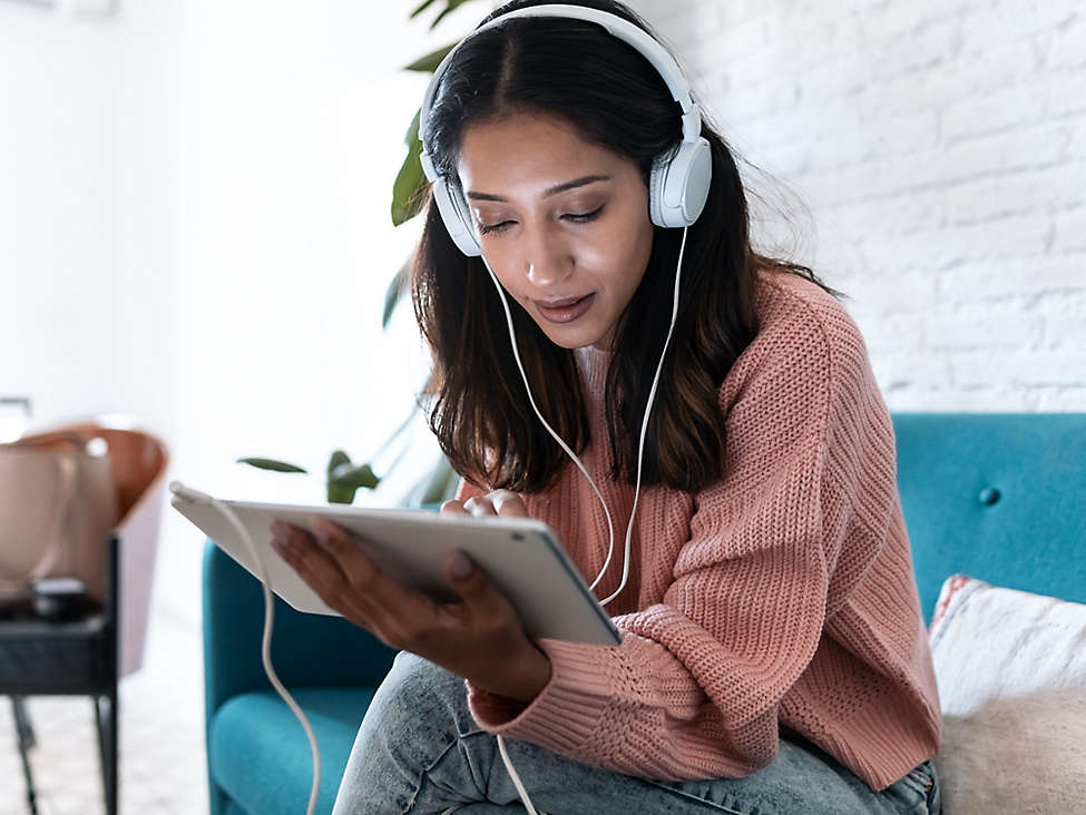 Women listening to music on Ipad