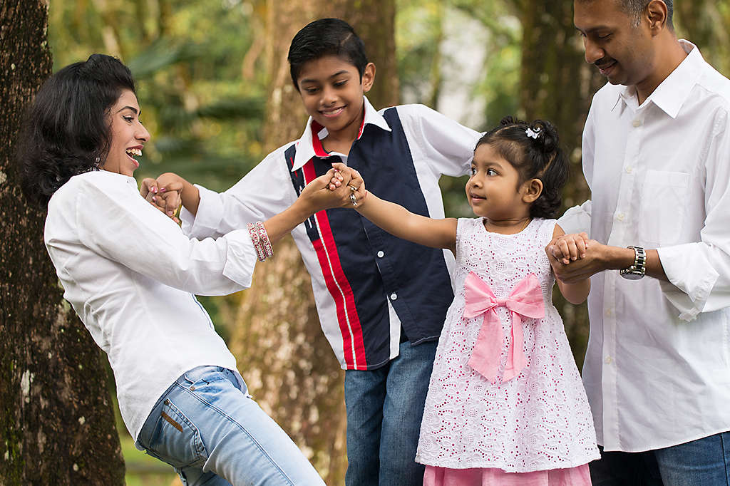 South Asian family walking outside