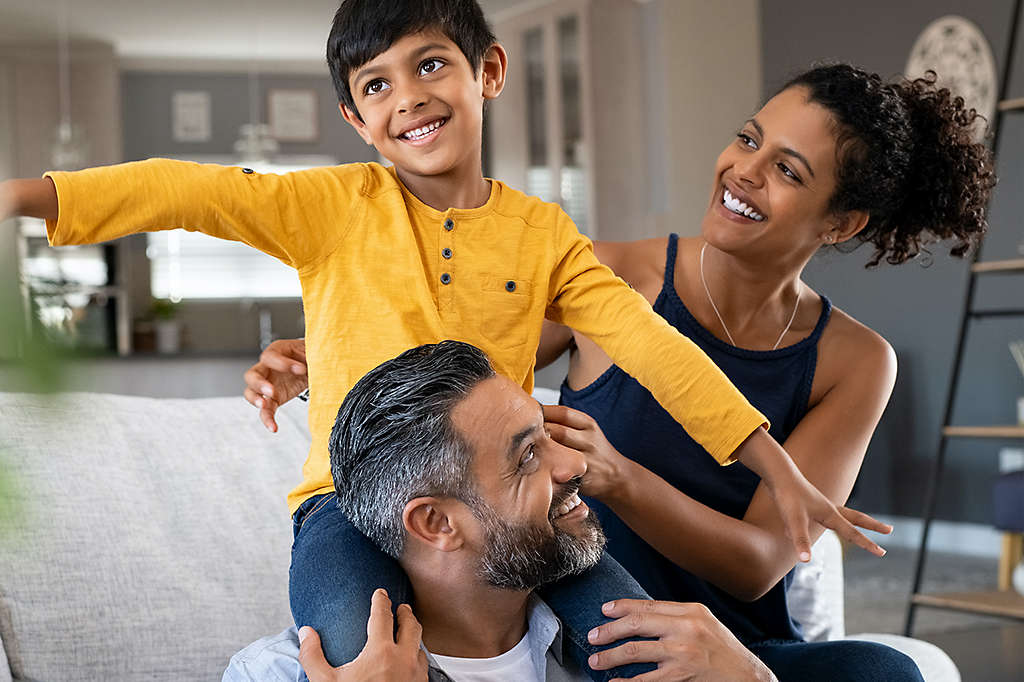 Family playing on couch