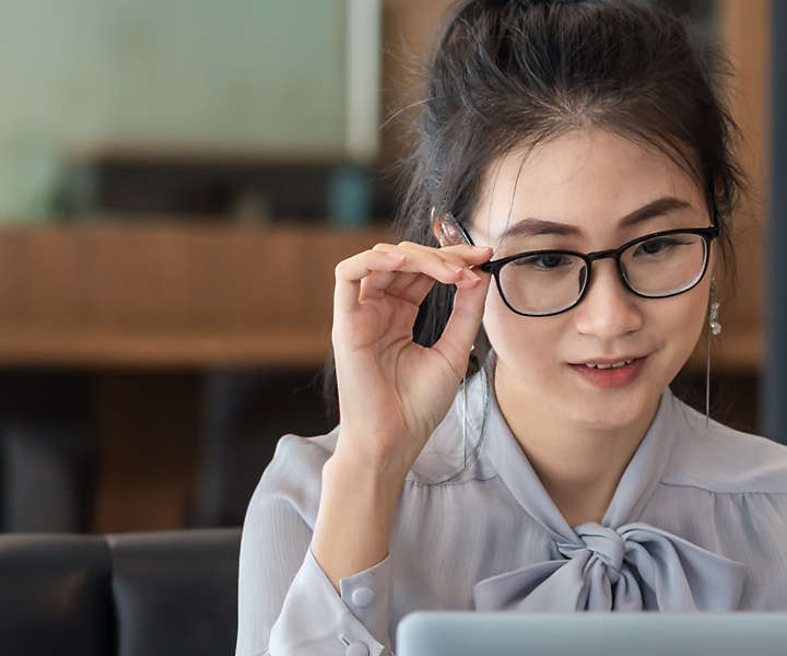 Asian women looking at computer