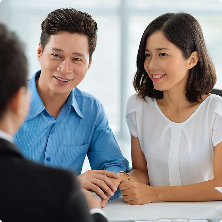 Vietnamese couple meeting with agent
