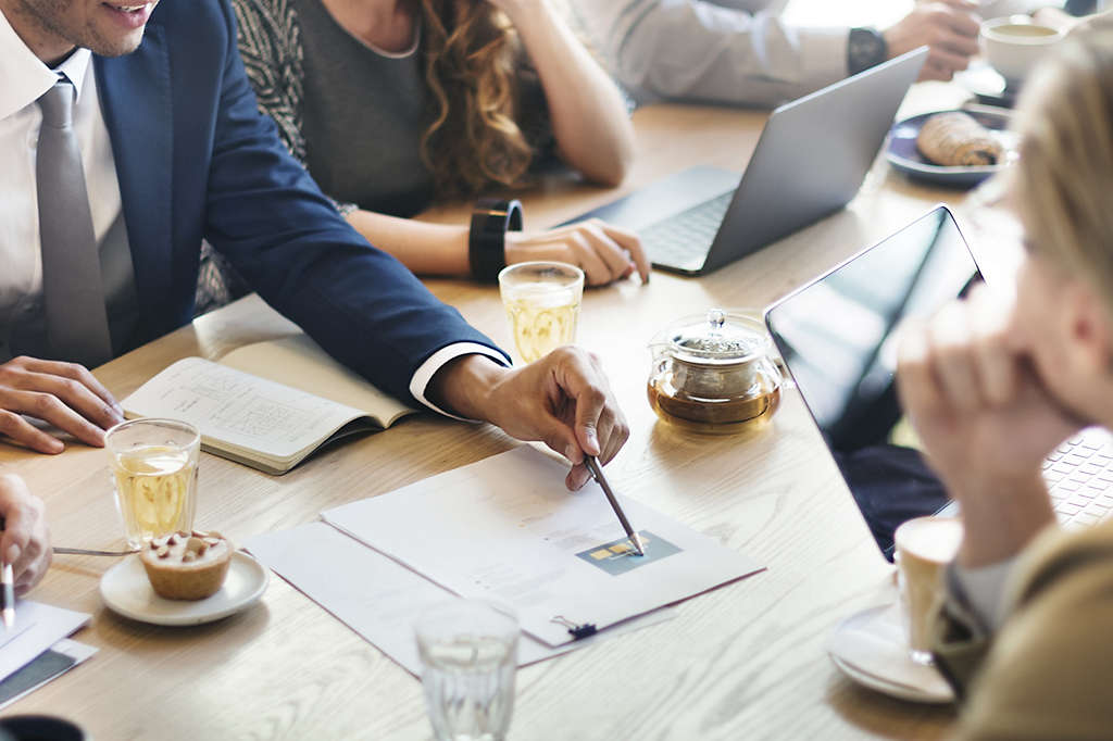 Group of professionals reviewing documents