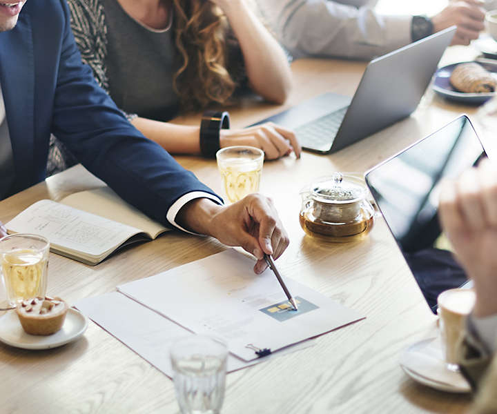 Group of professionals reviewing documents