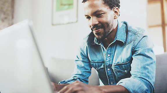 Man sitting on his laptop