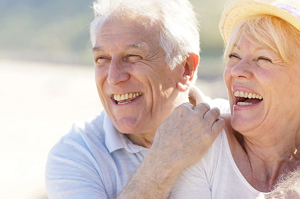 Elderly couple smiling together