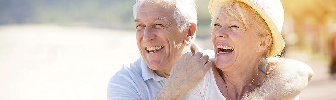 Elderly couple smiling together