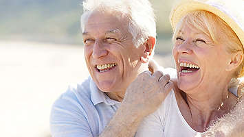 Elderly couple smiling together