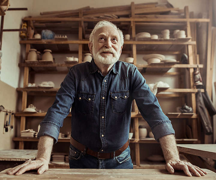 Older man in a pottery studio
