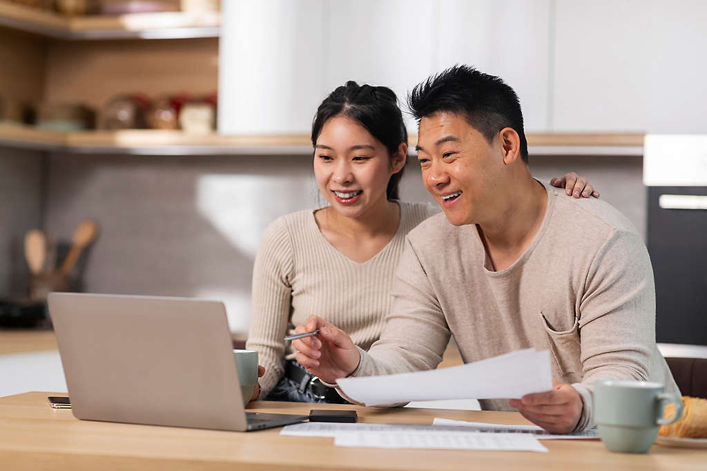 A man and a woman reviewing their finances