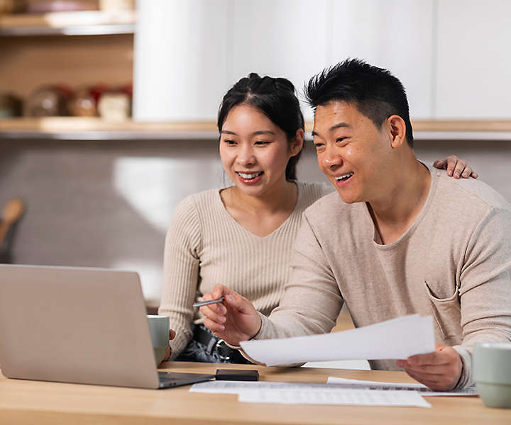 A man and a woman reviewing their finances