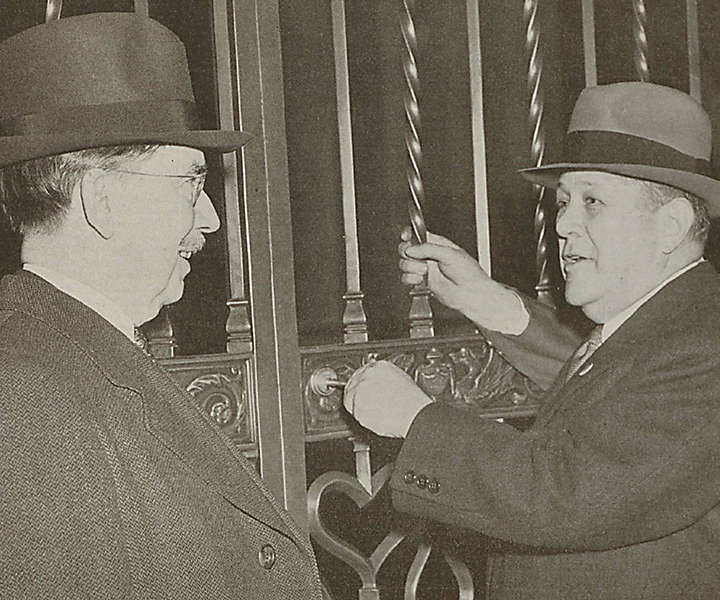 Company President George L. Harrison turned the key in the Madison Avenue gate to open the Home Office for New York Life's 100th year of business