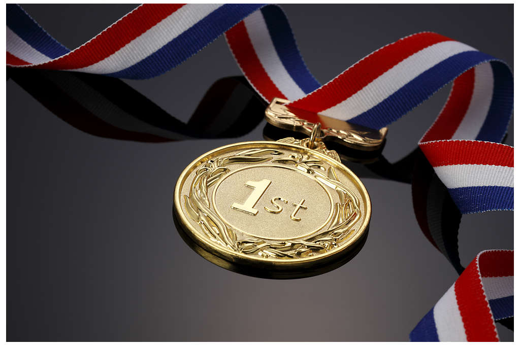 Gold medal on black background