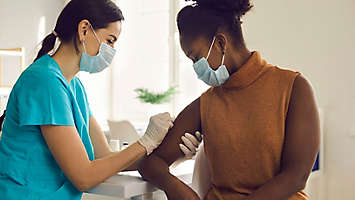 A person receiving the COVID vaccine