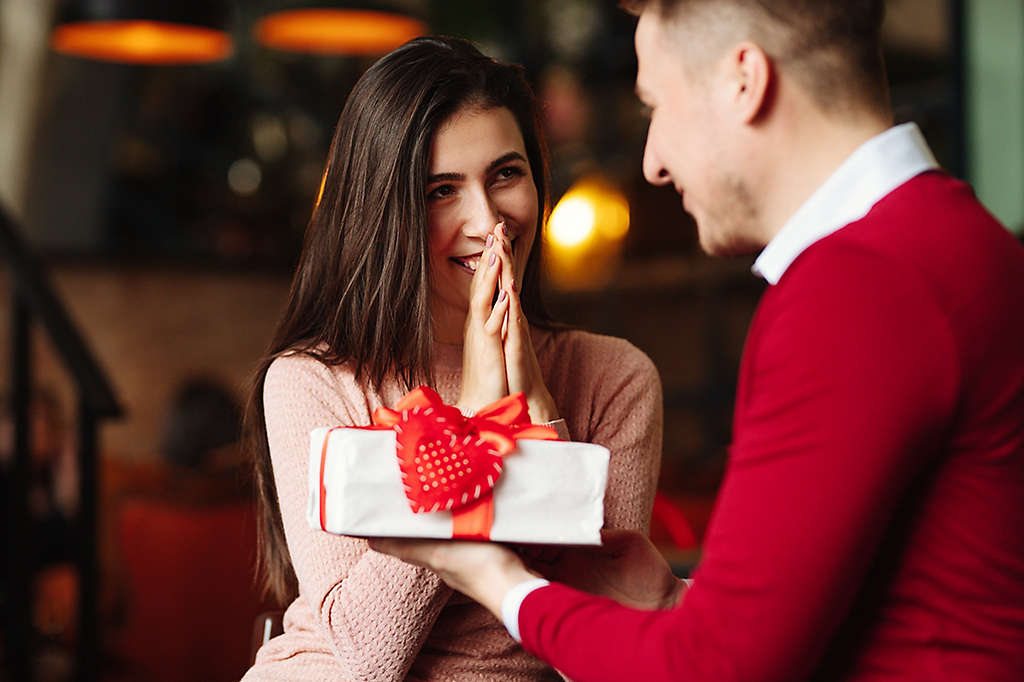 A couple exchanging gifts