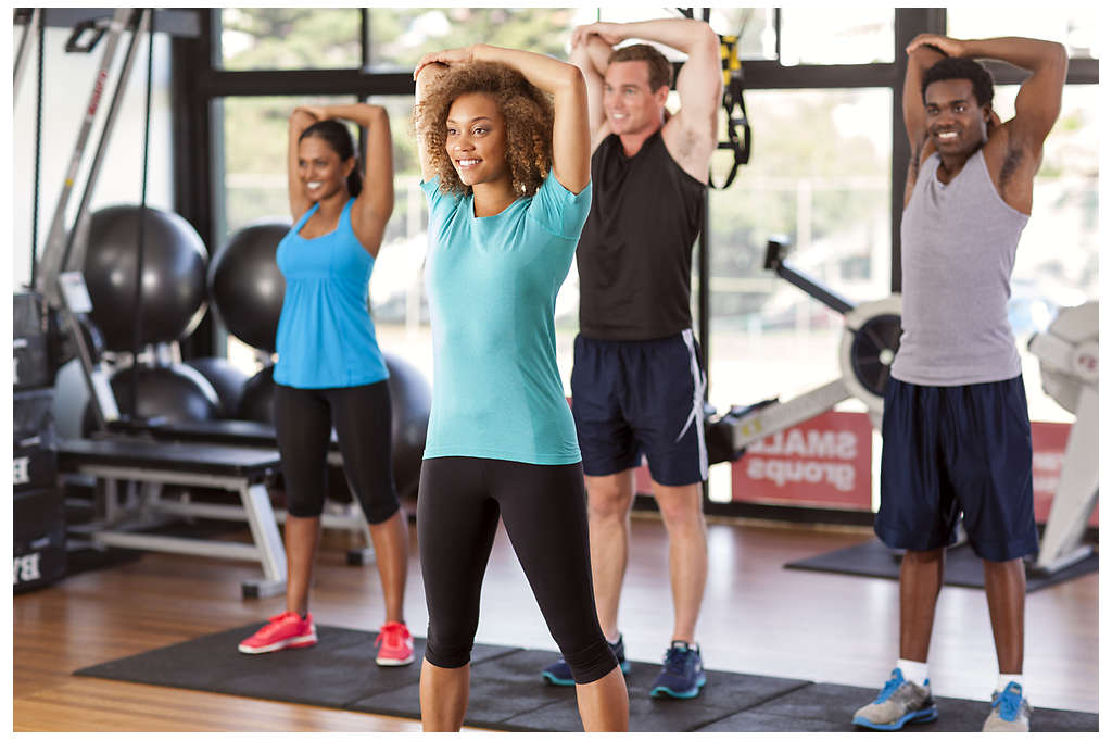 A group of people working out in a gym