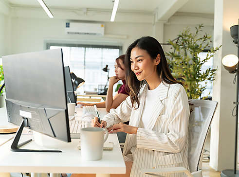 A woman using her laptop at work