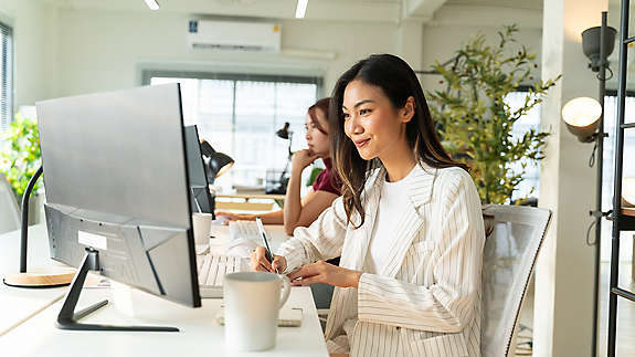 A woman using her laptop in office