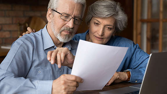 An eldery couple reviewing their finances