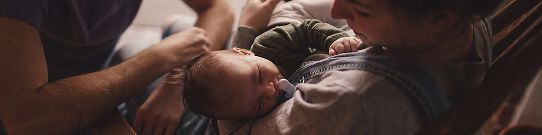 Young parents with their newborn baby
