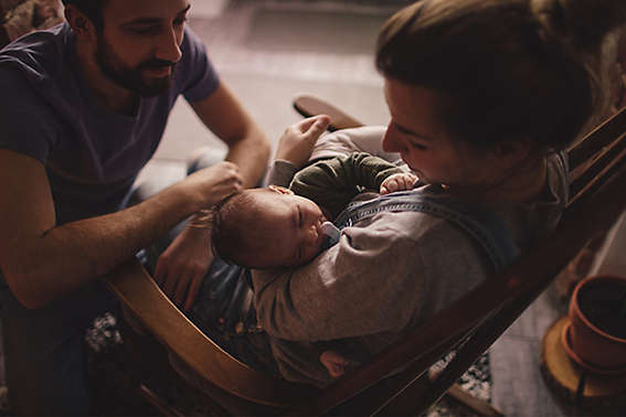 Young parents with their newborn baby