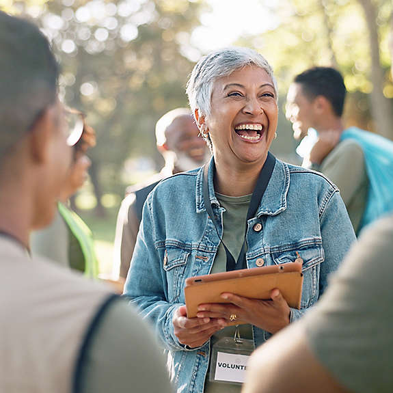 A woman volunteering in a park