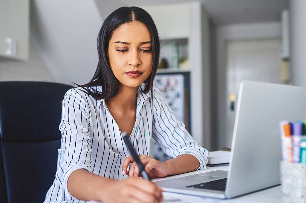 woman-writing-at-desk-1x1