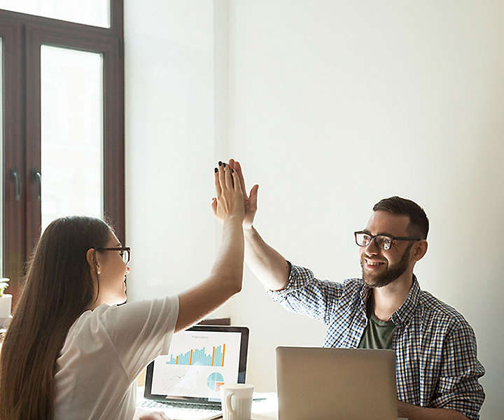 Man and Women High Fiving