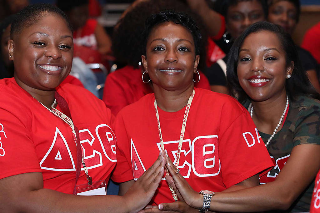 Three women smiling