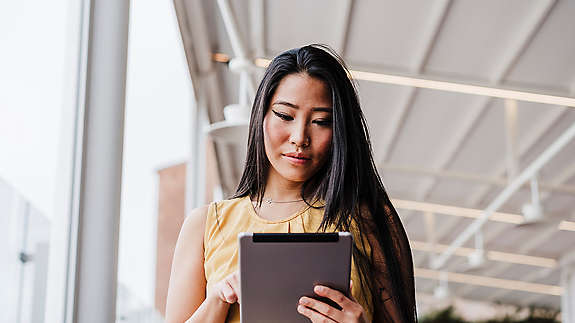 An employee trying to choose their benefits through an online tool – if possible they look frustrated