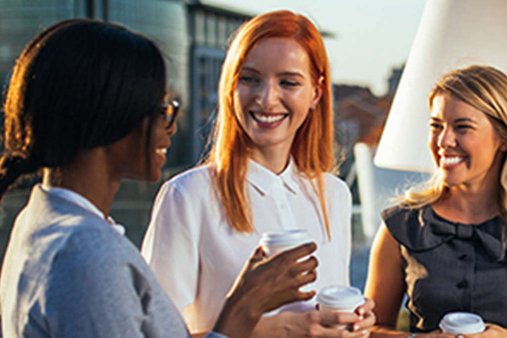 A group of employees talking at the office.
