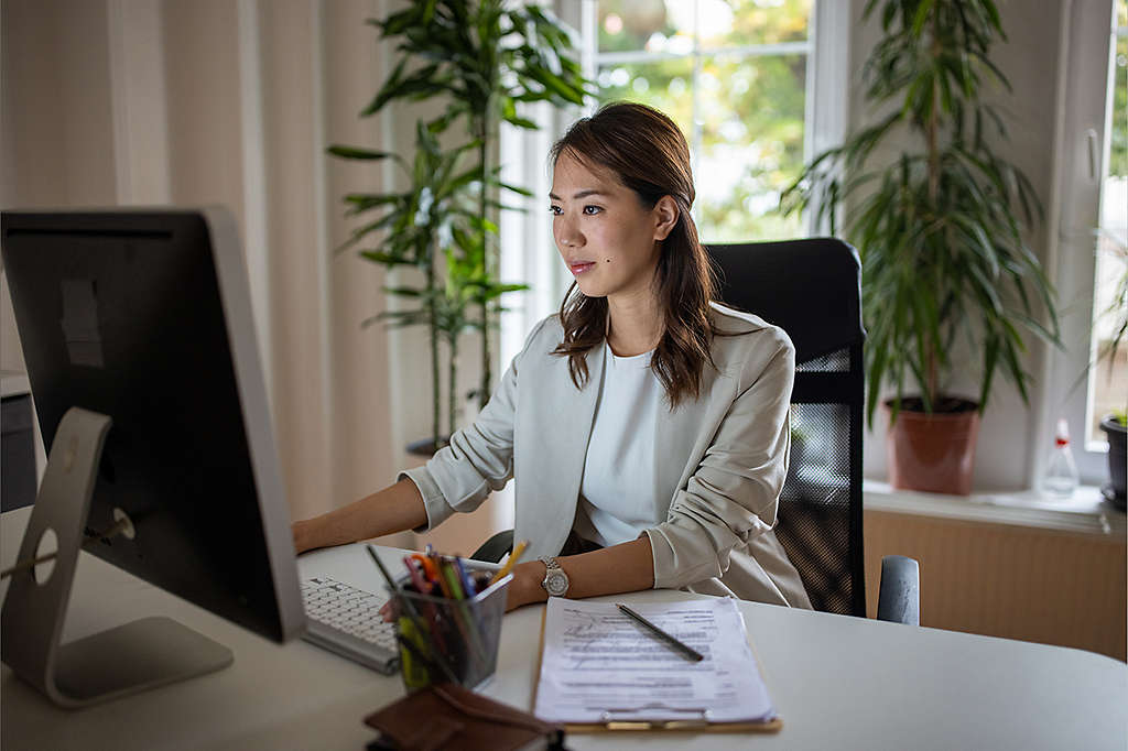 HR administrators watching a monitor that displays connected benefits.