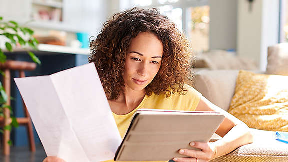 Young women looking at paperwork.