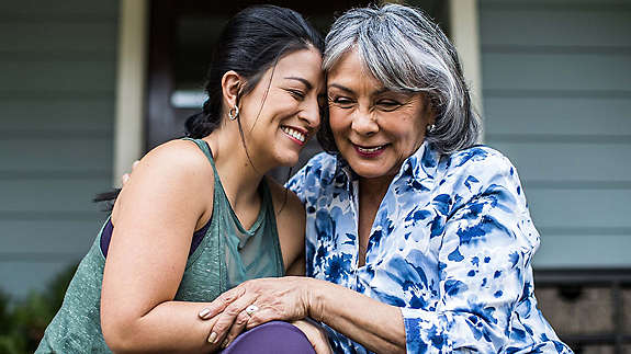Mother and daughter embracing 