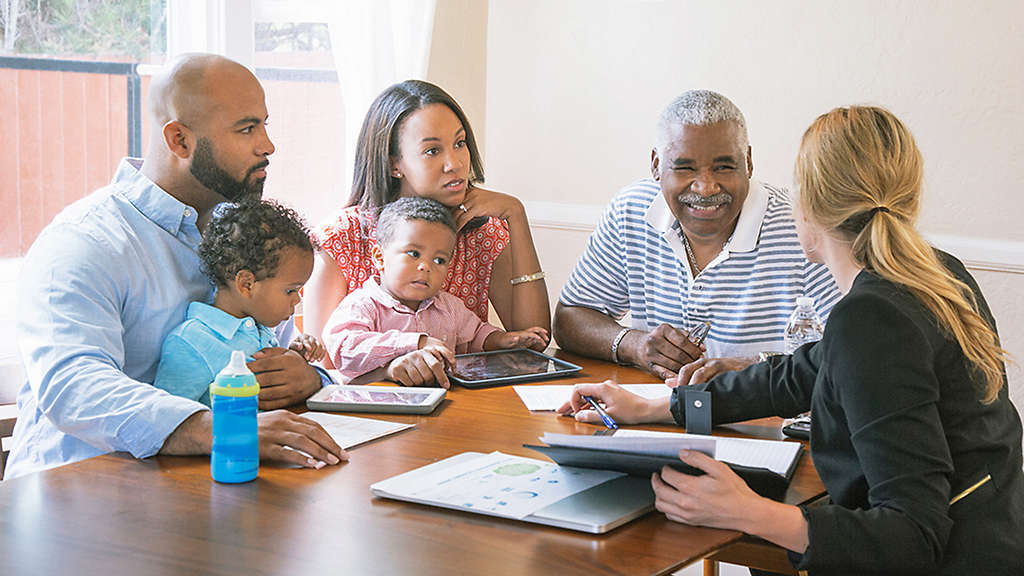 Couple meeting with a financial professional to discuss setting up a trust as part of their estate plan