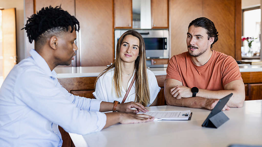 Couple reviewing retirement income and Medicare planning with a financial professional.