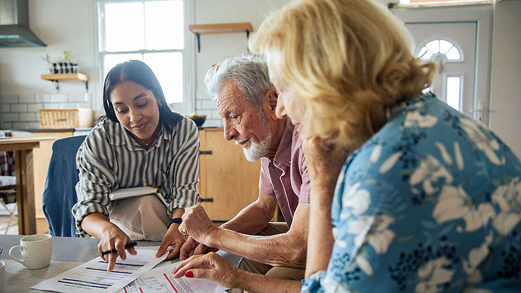 Retirees discussing annuities and retirement income strategies with a financial professional.