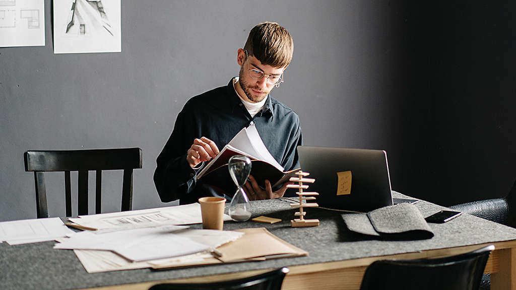 Individual comparing retirement account options and planning for retirement.