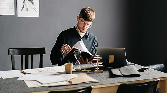 Individual comparing retirement account options and planning for retirement.