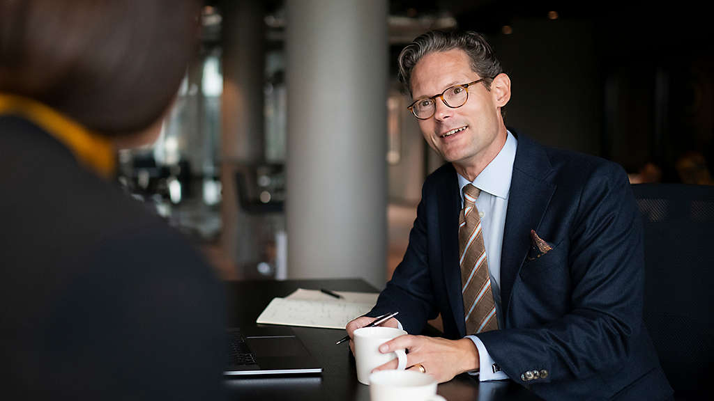 Investor reviewing a wealth management strategy with a financial professional