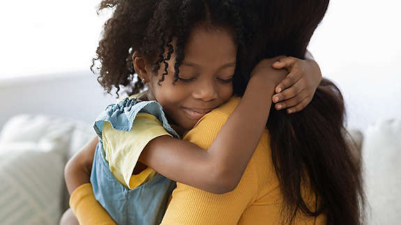 Teacher and student in front of class