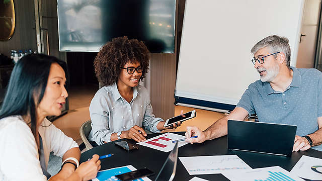 A group of people having a meeting.