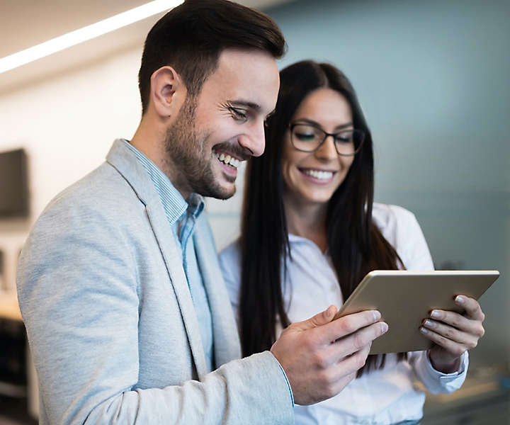 Woman and Man working on Ipad